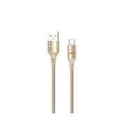 Gold USB cable with braided design on a white background