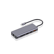 A gray Porodo USB-C hub with multiple ports, including USB-C, HDMI, Ethernet, SD card, and USB 2.0 ports, with a Type-C PD charging port and a 3.