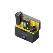 A wireless microphone with a remote control, showing the microphone mounted on a charging dock with a yellow and black color scheme.